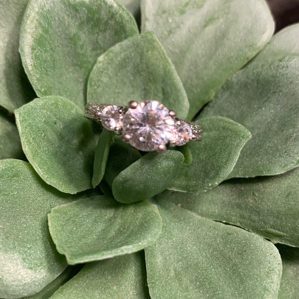 Antique style three stone diamond ring